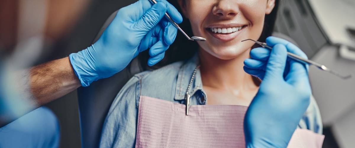 Woman receiving some form of dental treatment.