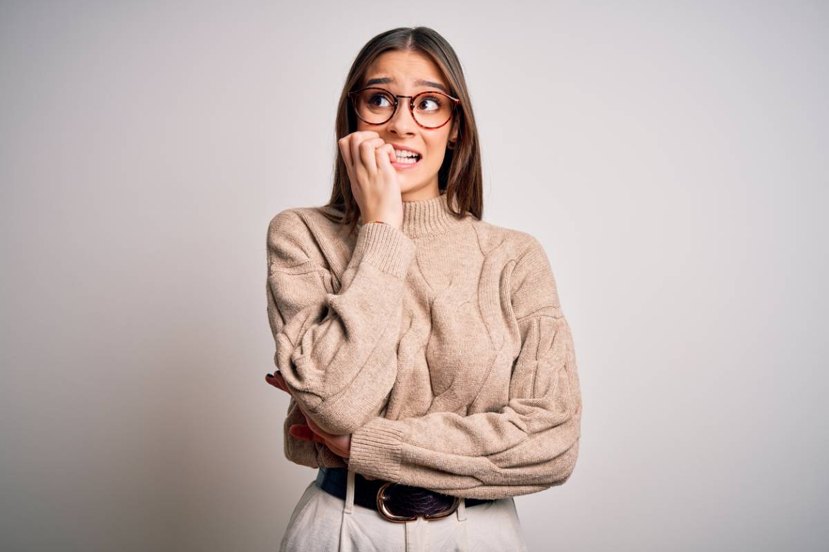 Woman chewing nails a bad habit for gums